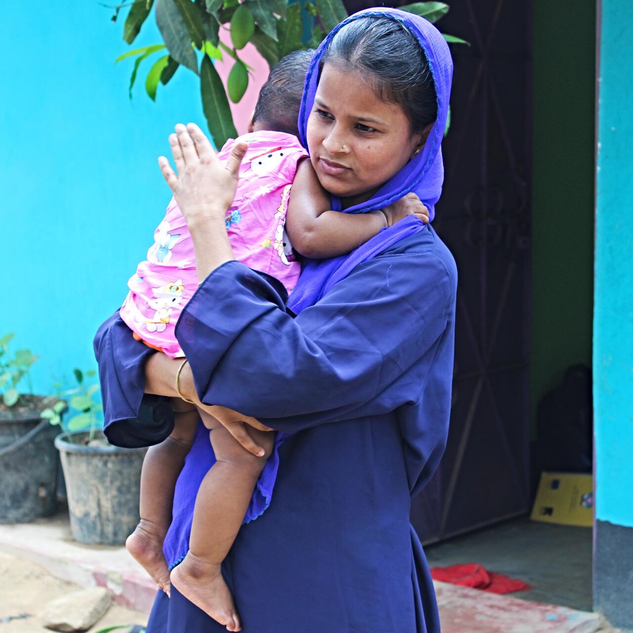 Lovely Akter with her nine-month-old daughter