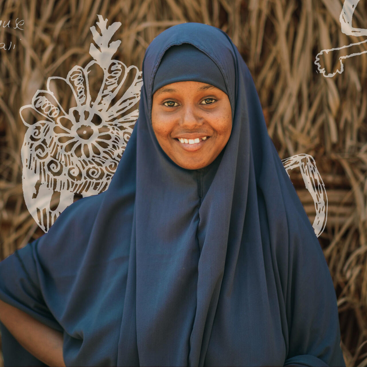 Nurta is smiling at the camera. Her drawings are displayed in the image behind her.