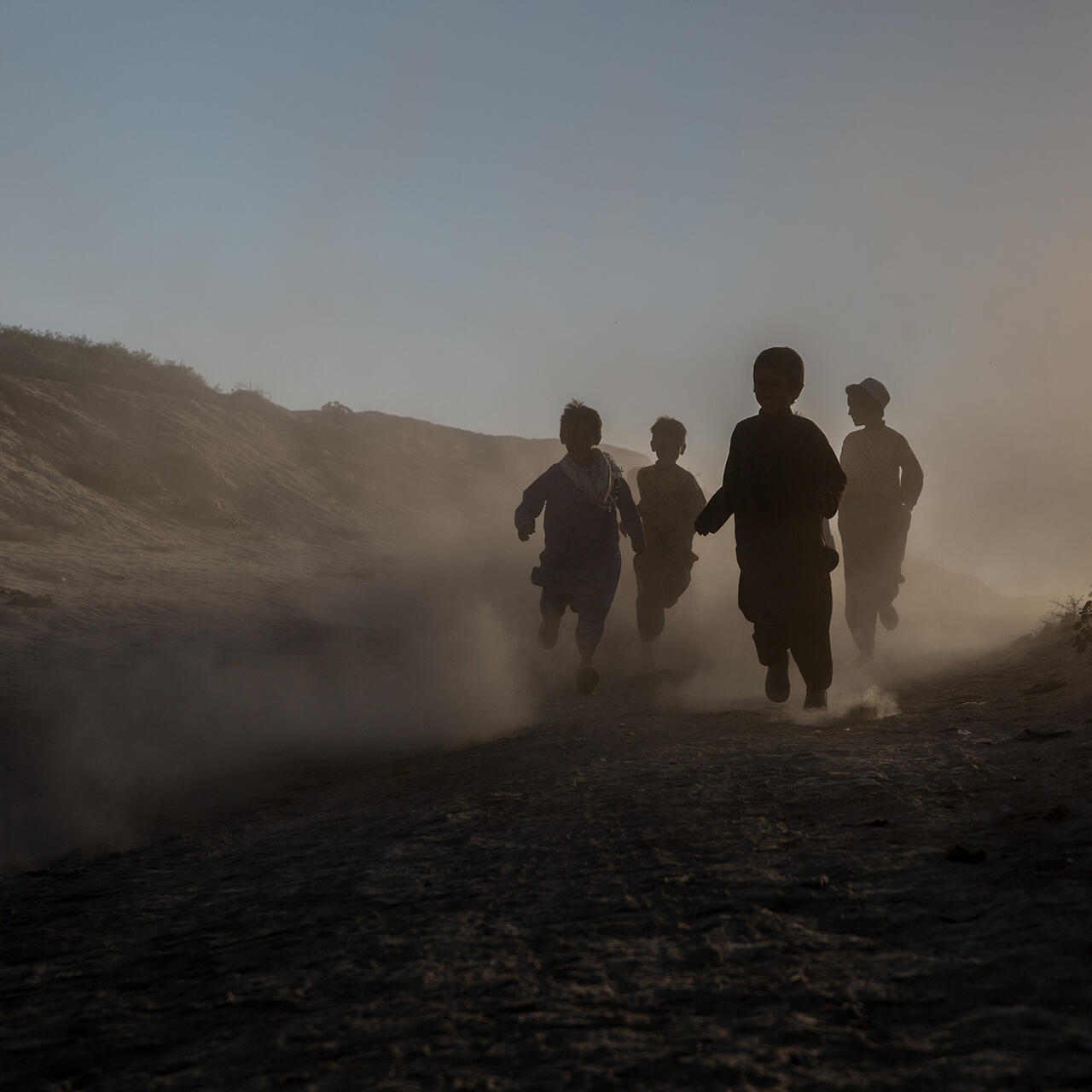 Children running through camp for drought displaced people right outside Qala-e-Naw, Badghis province in Afghanistan.