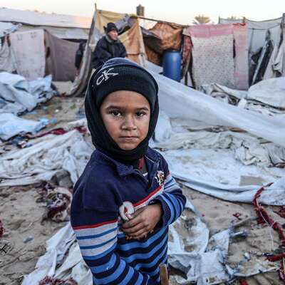 A child in front of tents in the Gaza Strip. 