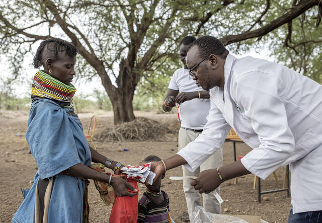 Ministry of Health (MoH) nutritionist screens child for malnutrition near RukRuk village in Turkana, Kenya
