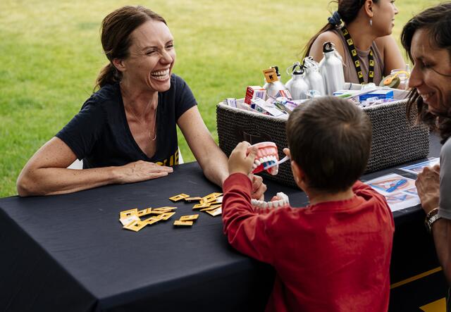 Jonessa White, health promotion specialist, at a booth helping families.