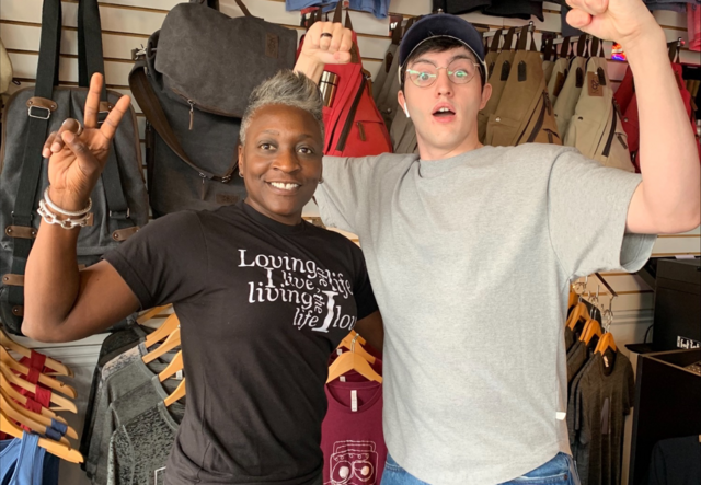 Patrice Hull and an associate throwing up peace signs.