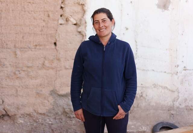 Sara, 36, from southern Mexico, poses for a portrait in the courtyard of a shelter in Ciudad Juárez