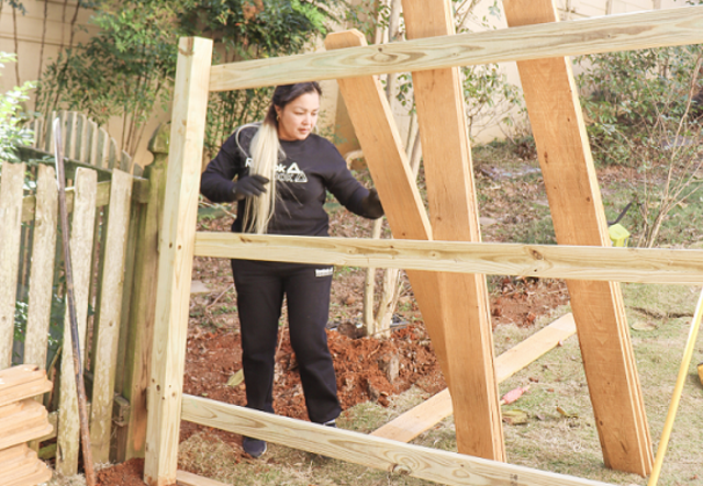 Victoria hard at work on a residential fence build project.