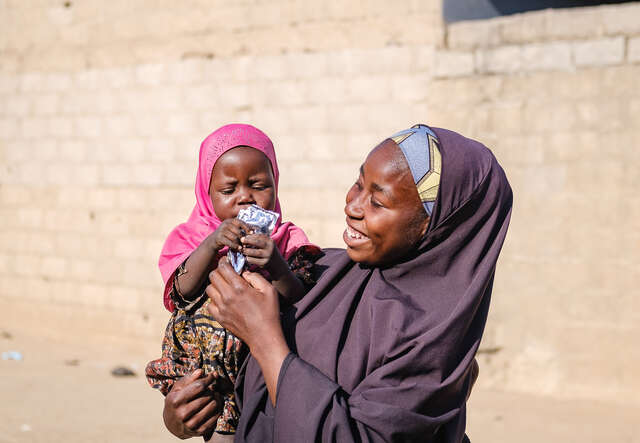 Fatima holds her baby Zara.