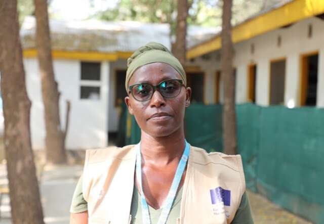 Teacher in Kakuma refugee camp looking at camera