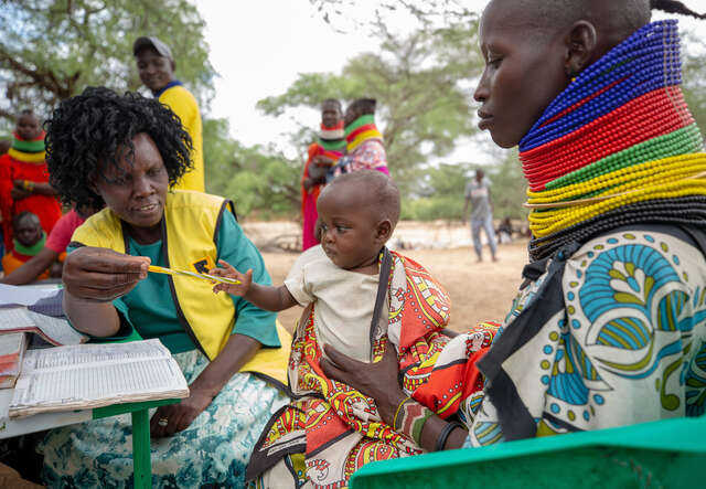 An IRC nurse attends to a child during an IRC community outreach program in Turkan, Kenya.