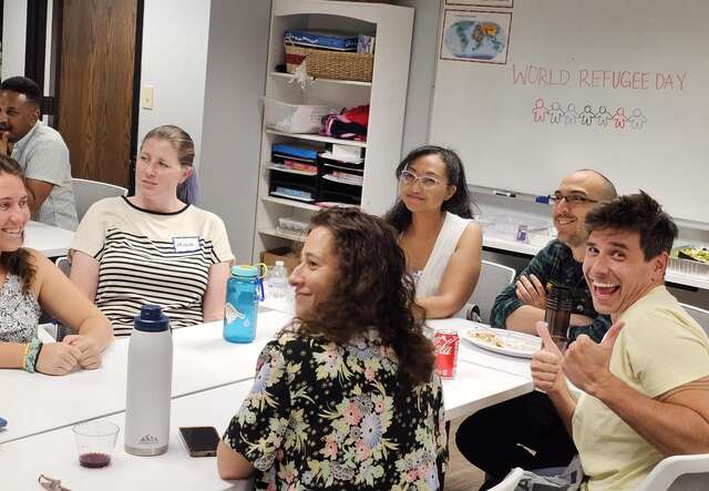 Trivia team giving smiles and thumbs up mid-trivia-round