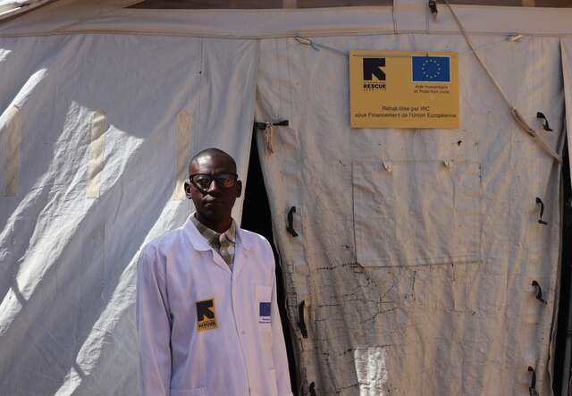 Dr Traoré stands in front of the IRC Intensive Nutrition Rehabilitation Unit (URENI). Originally established for the COVID-19 response, this EU-funded tent now helps expand the centre’s capacity to care for more children with severe acute malnutrition and medical complications.