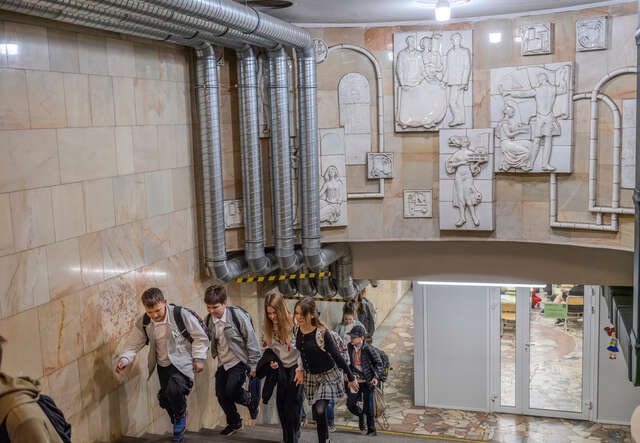 In Kharkiv, Ukraine, children leave an underground school after a session organized by the IRC.