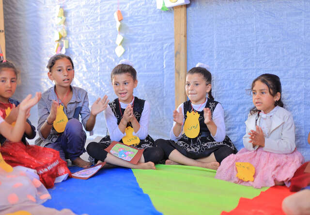 Displaced children take part in an activity organized by the IRC and Save Youth Future Society.