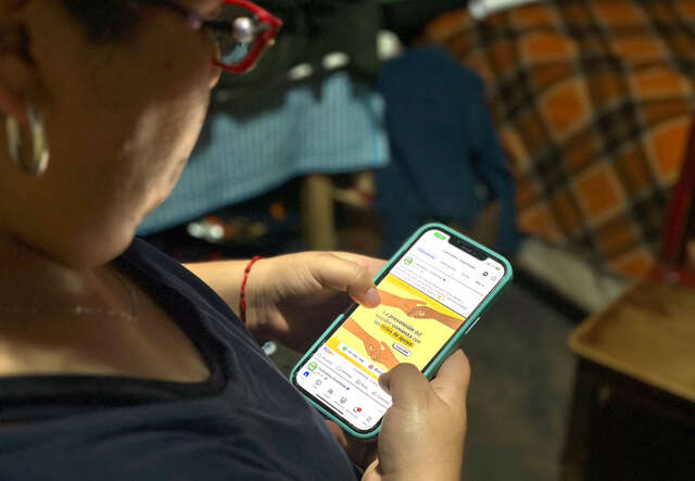 Woman looking at phone.