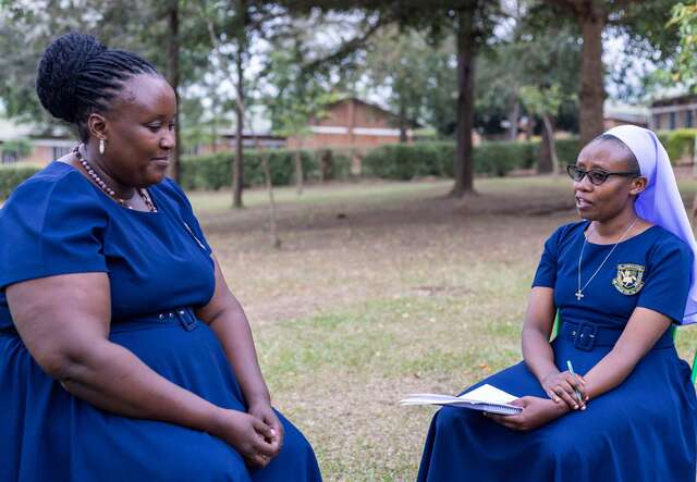 This image shows two teachers in conversation