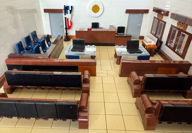 A Lego display of a U.S. immigration courtroom