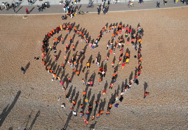 In Brighton, Together with Refugees met on Brighton Beach to create a giant orange heart, spreading the message that refugees are welcome in the UK.