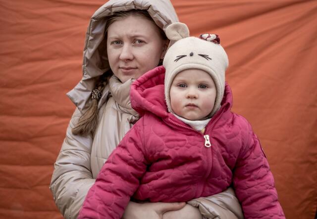 A woman holding her daughter
