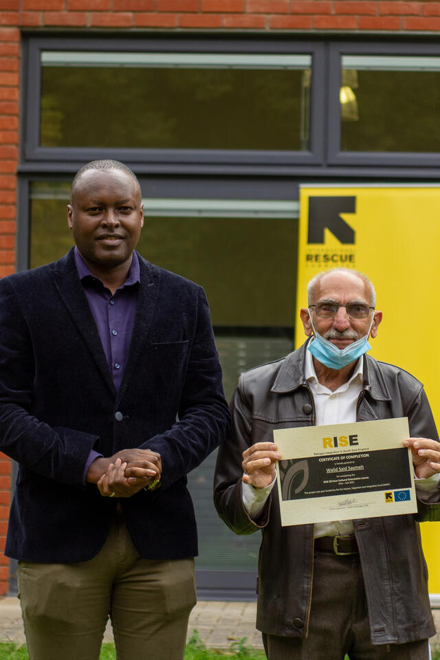 RISE Project Manager Emery Igiraneza with IRC client Walid.