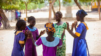 Oudjila, Cameroon. Wedé Clémautine, 12, Asta Julienne, 14 and some of their classmates having fun in the school playground.
