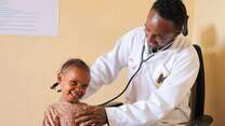 An IRC doctor treats a young patient in Ethiopia.