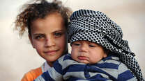 Two Syrian refugee children in Zaatari camp, northern Jordan. 