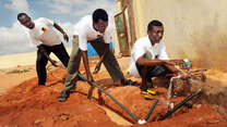 An IRC team installs water to a primary school in Galkayo, Somalia. 