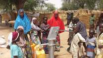 Children collect water at a tap in the Diffa region of Niger, which has seen a large influx of refugees from Nigeria.