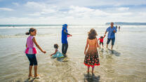 The Tlas family from Syria on a California  beach