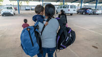 Central American mother with her child after being released from detention