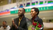 Congolese refugees Devin and Nadine await family members arriving at Boise Airport.