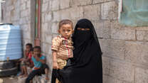 A Yemeni mother holds her young son.