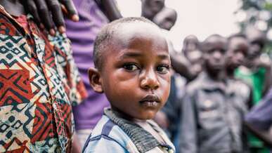 A young boy poses for a photo.