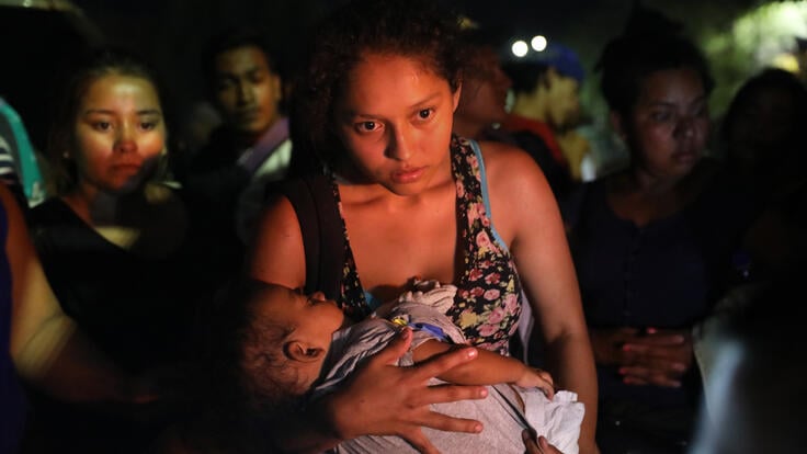 Central American asylum seekers wait for buses to take them to Tijuana on the U.S.-Mexico border. Photo: Getty Images