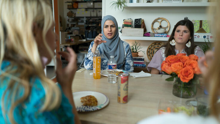 Bothina Matar with colleagues around a lunch table at  the Gaia office in Dallas 