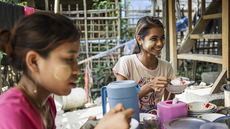 A group of girls sewing.