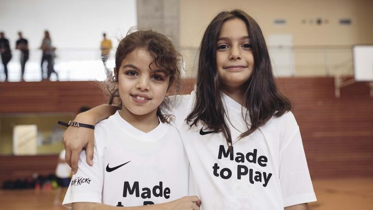 Two friends smiling for a photo together.